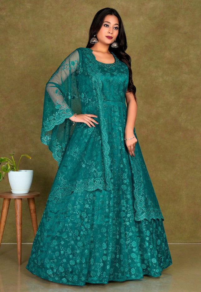 Woman wearing a teal embroidered dress Net Gown For Women