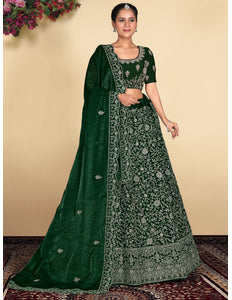 Woman wearing a green embroidered traditional outfit