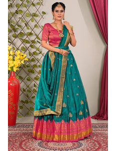 Woman wearing a teal saree with pink blouse with dupatta