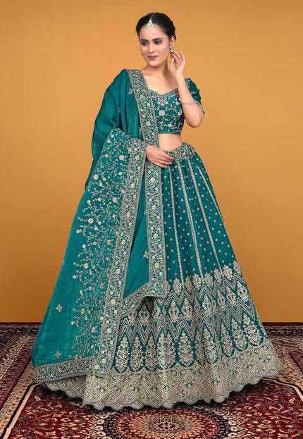 Woman in a teal embroidered traditional lehenga choli