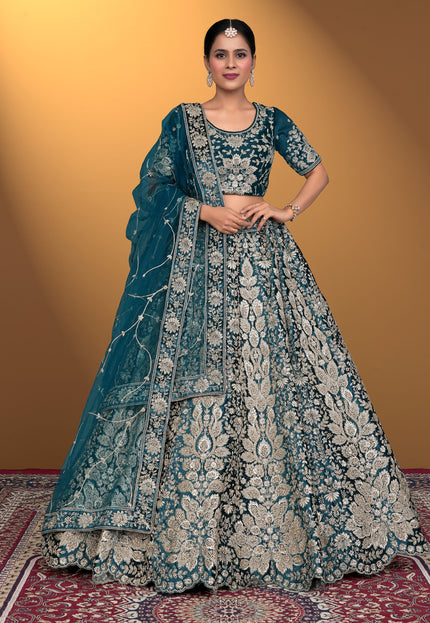 Woman wearing a traditional blue embroidered lehenga choli