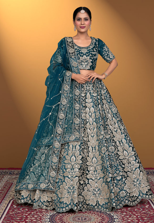 Woman wearing a traditional blue embroidered lehenga choli