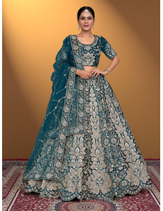 Woman wearing a traditional blue embroidered lehenga choli