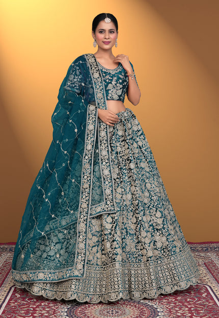 Woman wearing a traditional blue and white embroidered lehenga