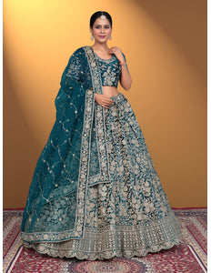 Woman wearing a traditional blue and white embroidered lehenga