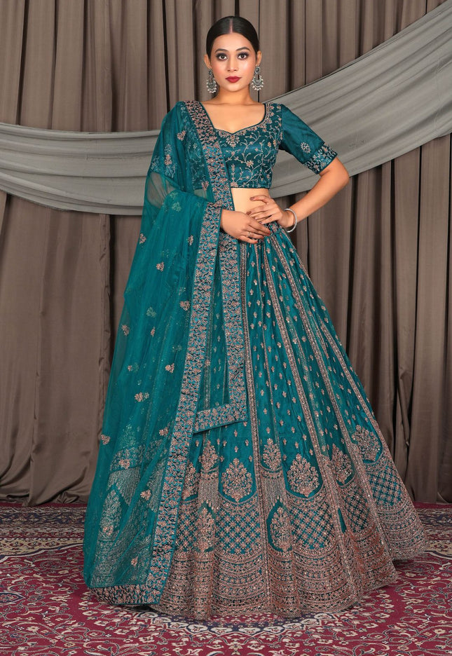 Woman in a teal and brown traditional outfit