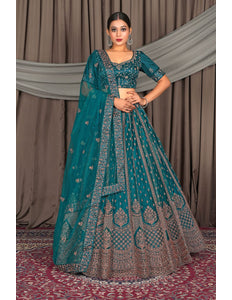 Woman in a teal and brown traditional outfit