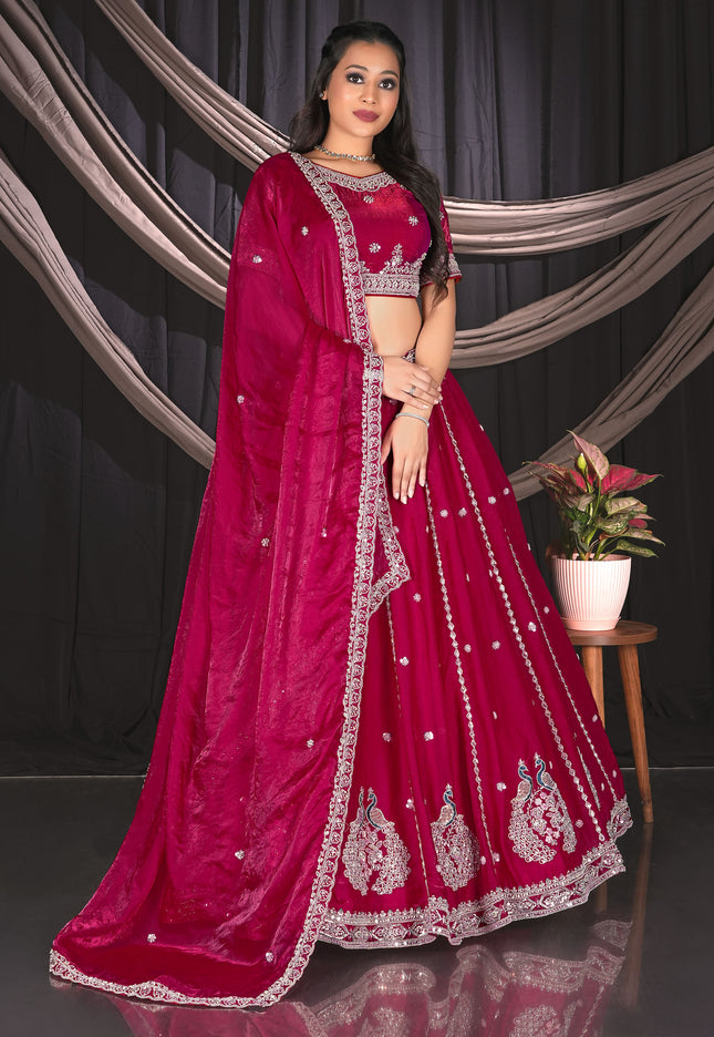 Woman in a pink embroidered traditional lehenga