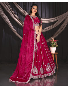 Woman in a pink embroidered traditional lehenga