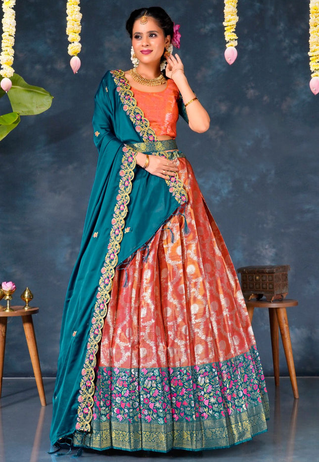 Woman wearing a pink and blue traditional lehenga choli with dupatta