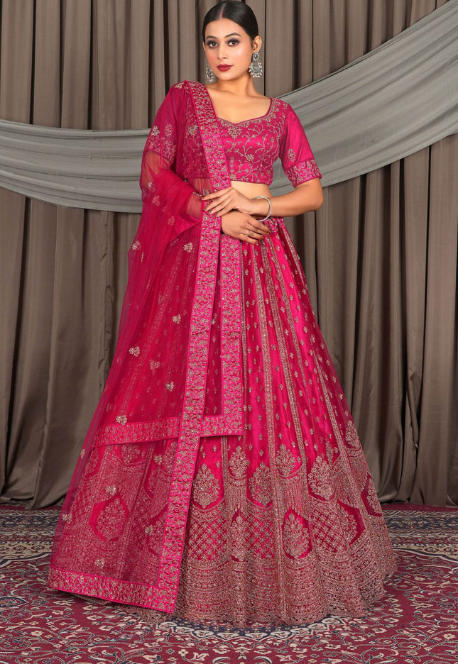 Woman wearing a pink embroidered traditional outfit