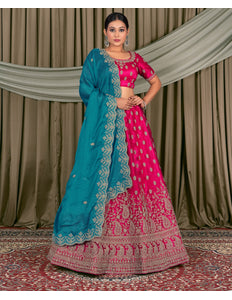 Woman wearing a traditional pink and blue lehenga choli