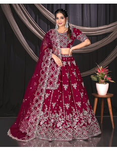 Woman in a Pink embroidered traditional lehenga choli