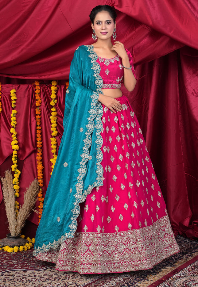 Woman in a pink and blue traditional lehenga choli
