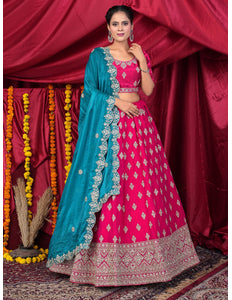 Woman in a pink and blue traditional lehenga choli