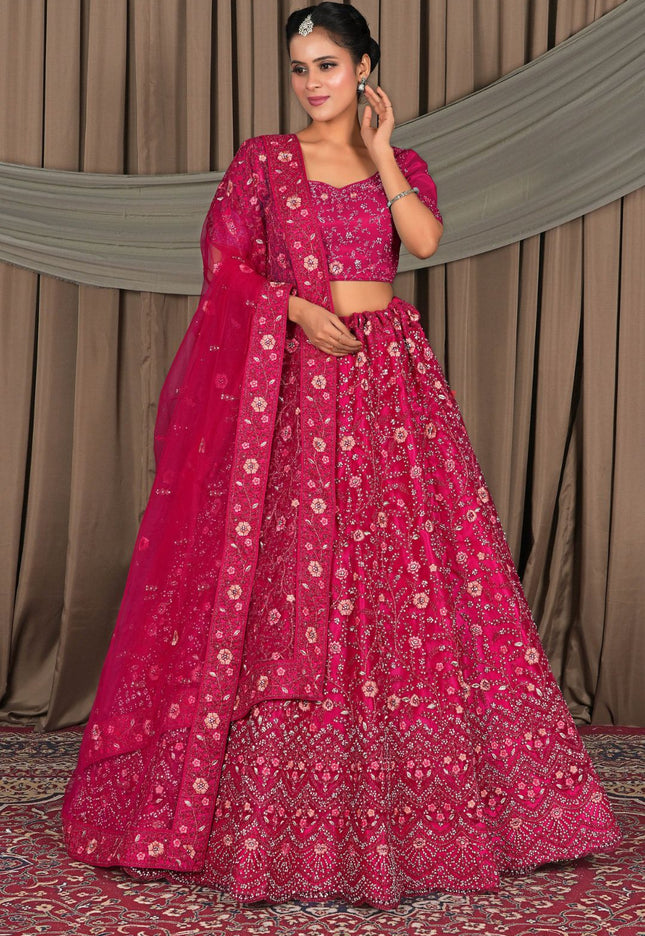 Woman in a pink traditional outfit with a floral pattern