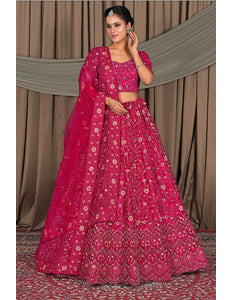 Woman in a pink traditional outfit with a floral pattern