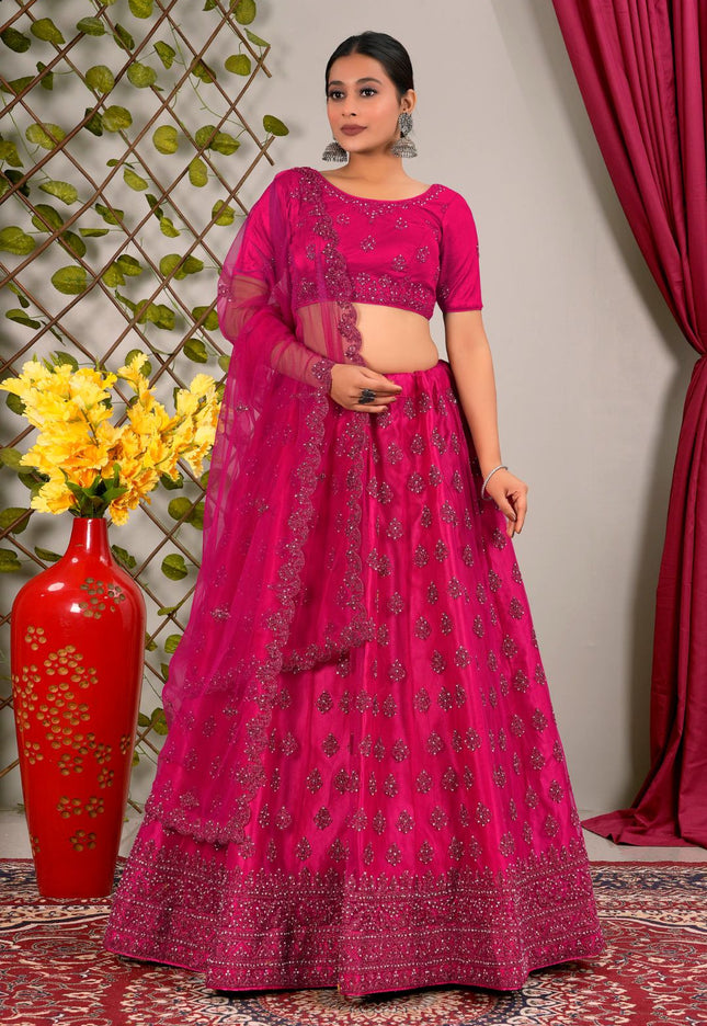 Woman in a pink traditional lehenga choli with dupatta