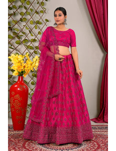 Woman in a pink traditional lehenga choli with dupatta