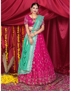 Woman in a pink and green traditional lehenga Choli