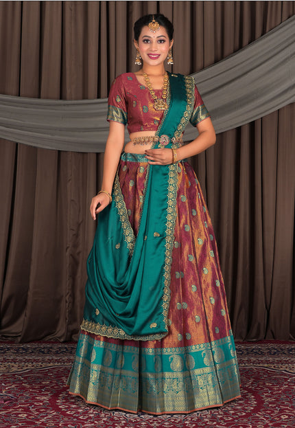 Woman in traditional Indian attire with a maroon lehenga with matching blouse