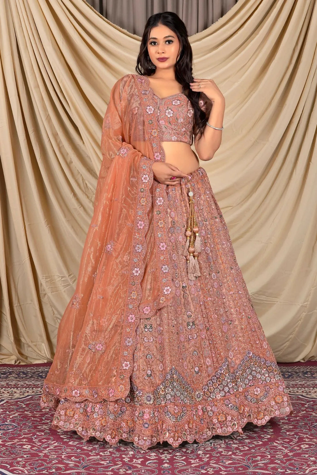 Rust Party Wear Embroidered Twill Net Lehenga Choli For Women