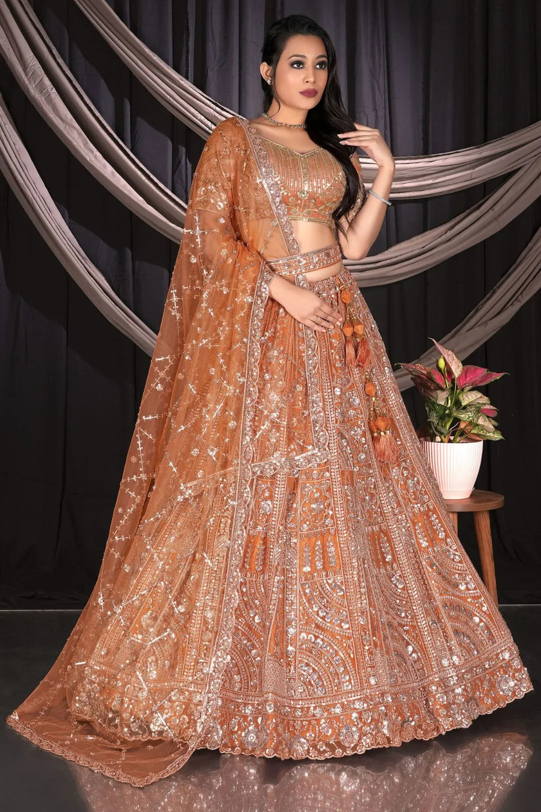 Rust Traditional Net Lehenga Choli With Dupatta