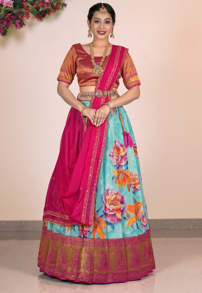 Woman wearing a traditional outfit with a floral skirt and pink blouse