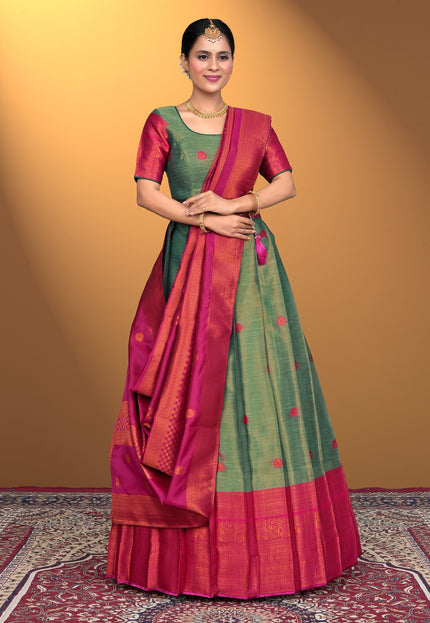 Woman wearing a traditional lehenga choli with a green and pink pattern