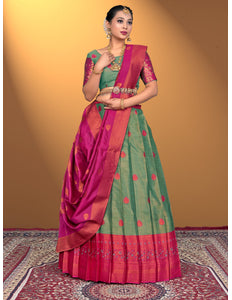 Woman wearing a green and pink lehenga with a green blouse