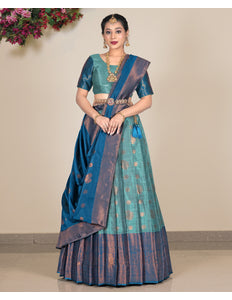 Woman wearing a traditional sea green lehenga with a matching blouse