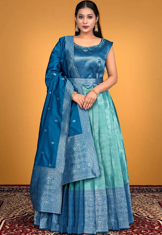 Woman wearing a blue and green traditional outfit