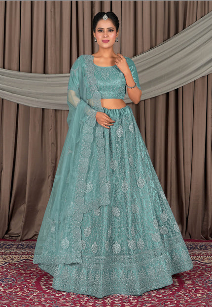 Woman wearing a light blue embroidered traditional outfit