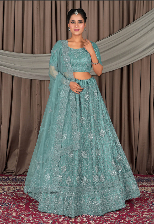 Woman wearing a light blue embroidered traditional outfit