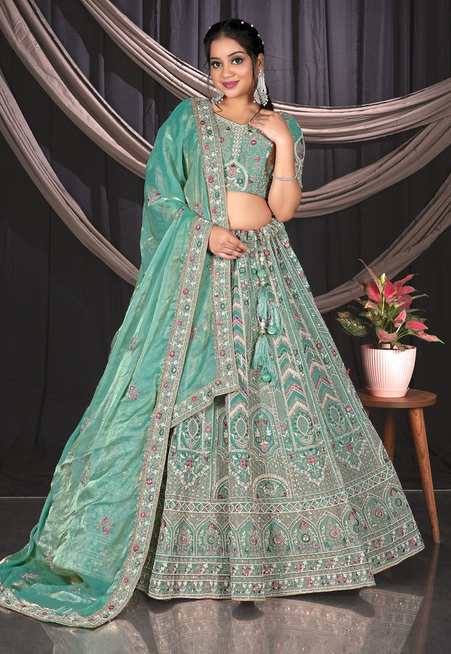 Woman in a Sea Green embroidered traditional outfit