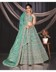 Woman in a Sea Green embroidered traditional outfit