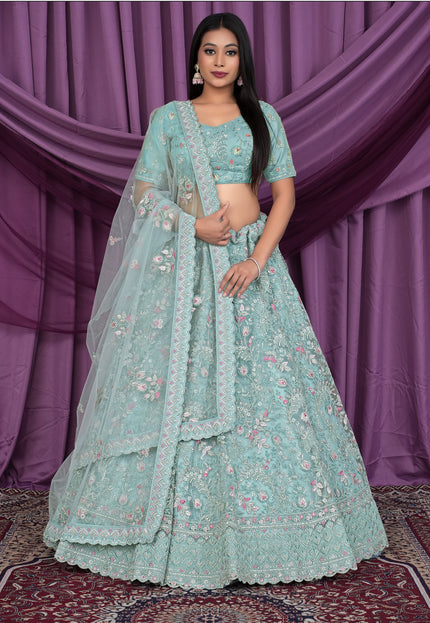 Woman wearing a light blue embroidered lehenga choli