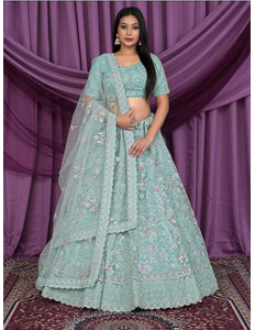 Woman wearing a light blue embroidered lehenga choli