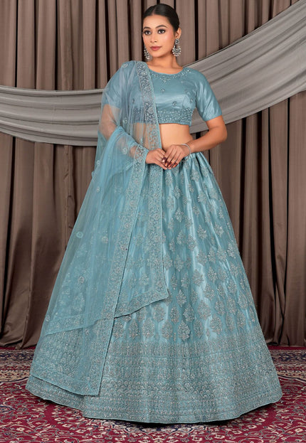 Woman wearing a traditional blue embroidered outfit