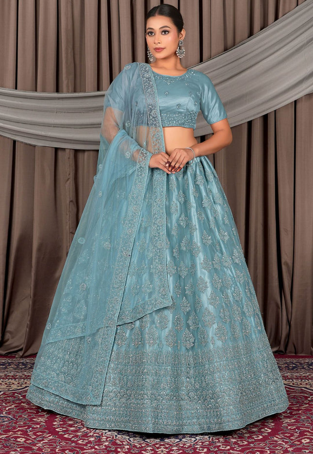 Woman wearing a traditional blue embroidered outfit