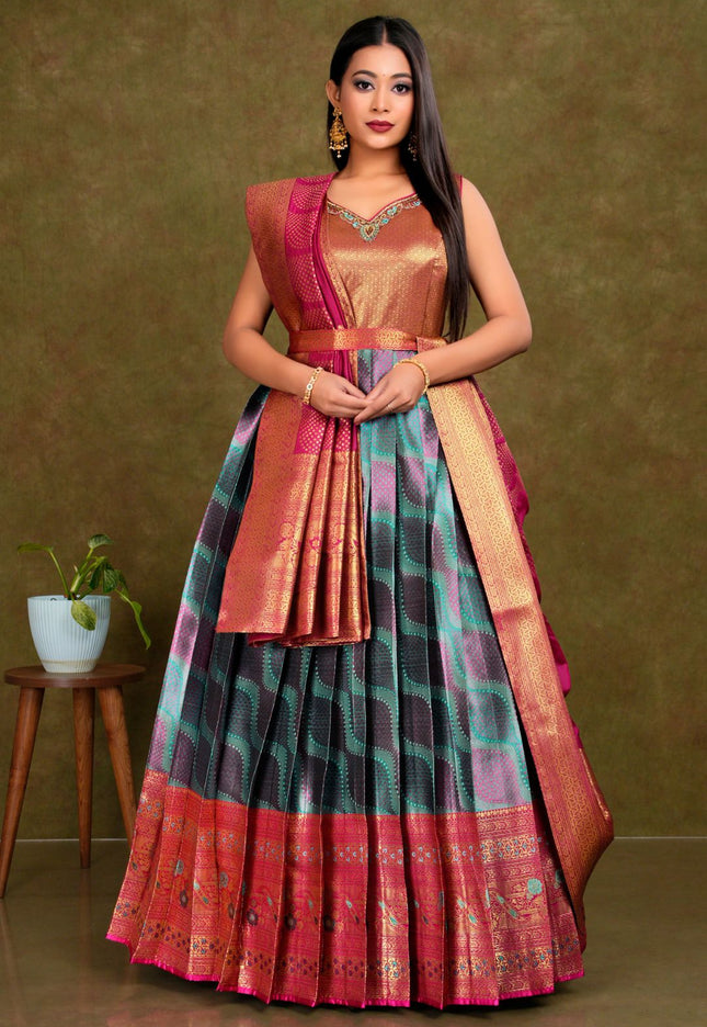 Woman wearing a traditional outfit with a green and pink patterned gown