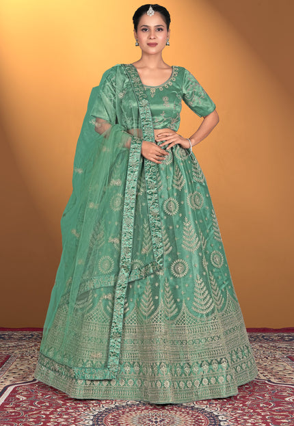 Woman wearing a green embroidered traditional outfit