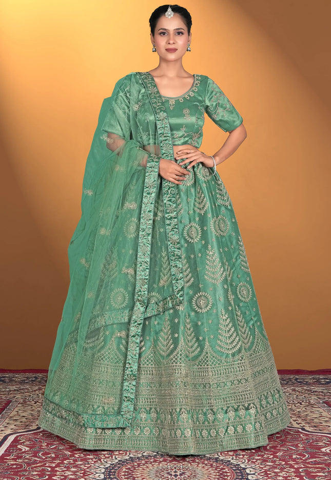 Woman wearing a green embroidered traditional outfit
