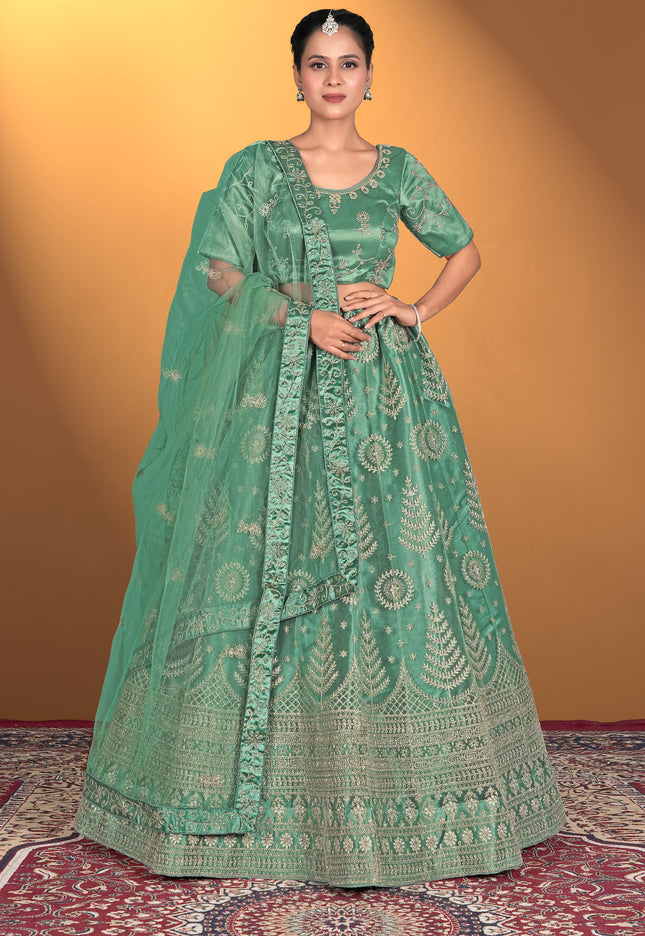 Woman wearing a green embroidered traditional outfit
