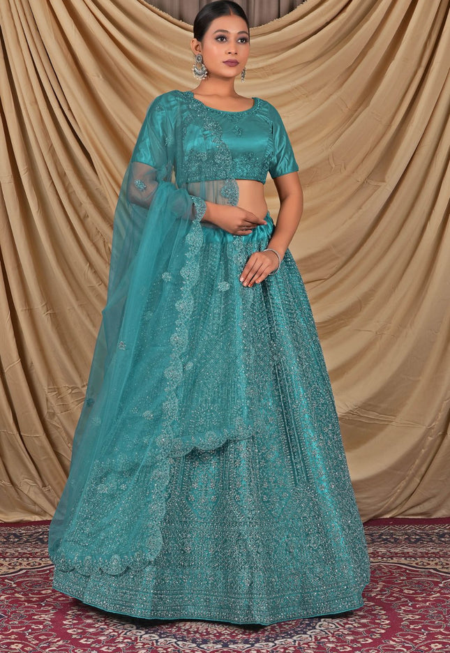 Teal embroidered traditional outfit with a matching dupatta and blouse