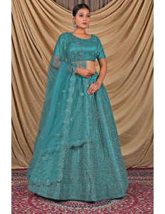 Teal embroidered traditional outfit with a matching dupatta and blouse