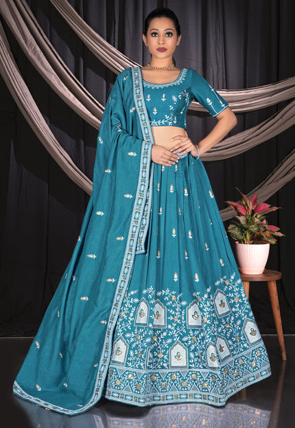 Woman wearing a teal embroidered traditional lehenga