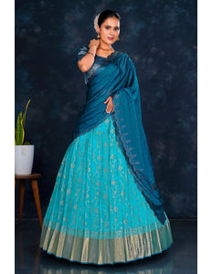 Woman wearing a blue lehenga choli with contrast dupatta