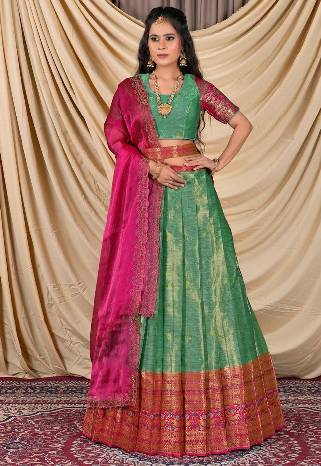 Woman wearing a green and pink traditional outfit