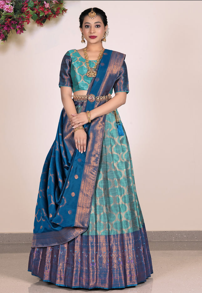 Woman wearing a blue and sea green lehenga